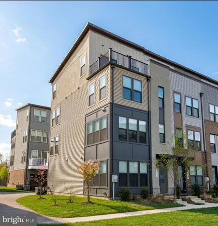 a front view of a building with a yard