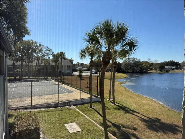 a view of a swimming pool with a patio