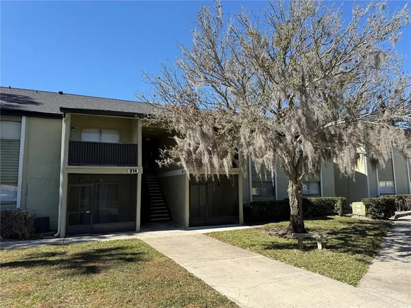 a house with trees in front of it