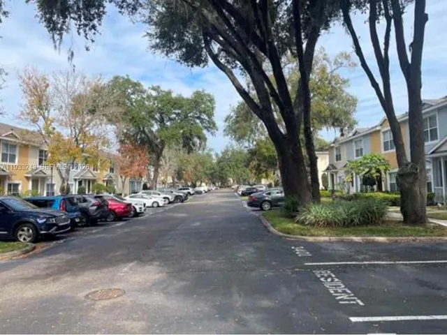 a view of street with parked cars