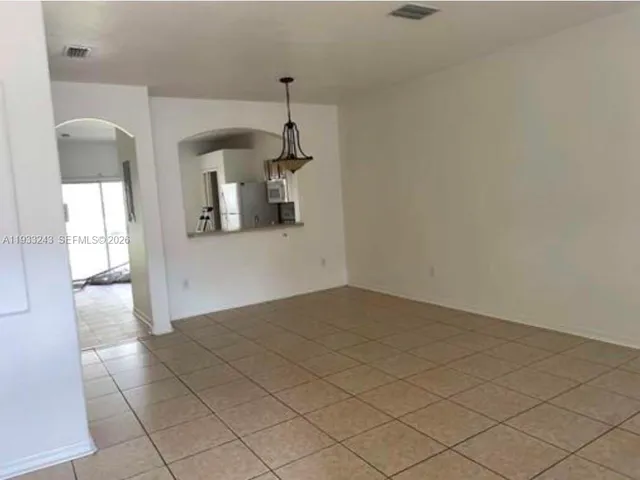 an empty room with a bathroom