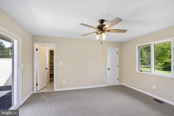 a view of an empty room with a window