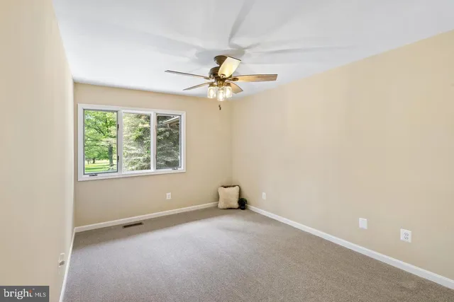 wooden floor and closet area in a room