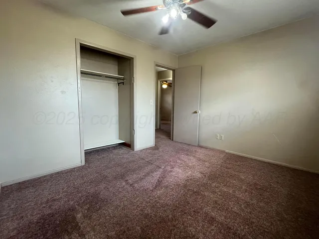 an empty room with a bathroom