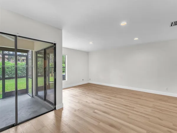 a view of a livingroom with furniture and a ceiling fan