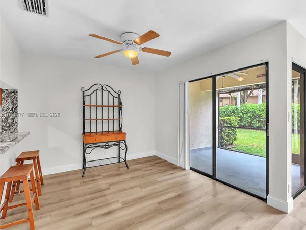 a view of entryway with wooden floor