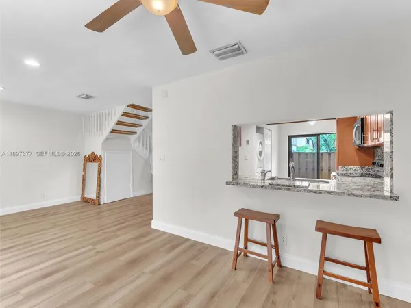 a bedroom with bed and a chandelier