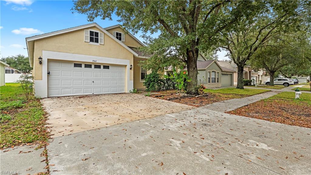 7947 Terrace Ridge Drive Temple Terrace, FL 33637 - Photo 2 of 38 View of front of property, concrete driveway and the garage