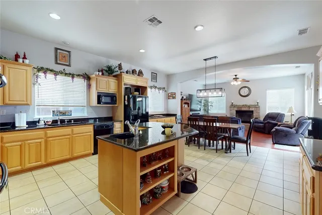 a kitchen with stainless steel appliances granite countertop a stove and a sink
