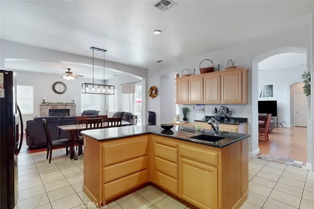 a kitchen with stainless steel appliances granite countertop a sink and a cabinets