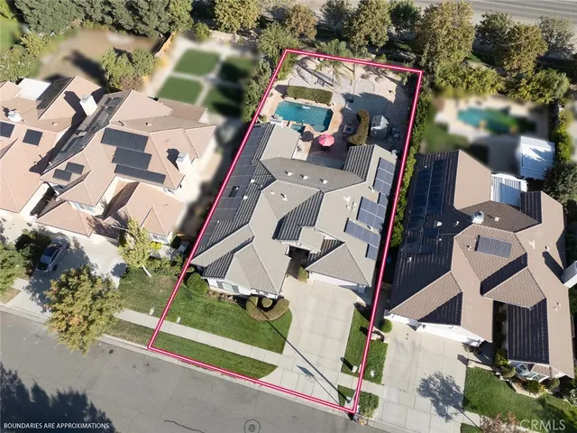 an aerial view of multi story residential apartment building with yard