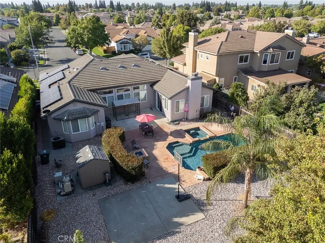 an aerial view of residential houses with outdoor space