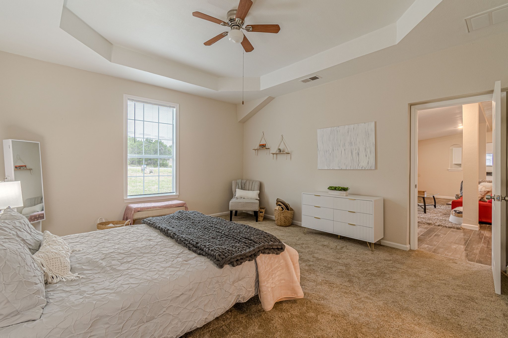 560 Persimmon Pass Fischer, TX 78623 - Photo 13 of 26 a bedroom with a bed and ceiling fan