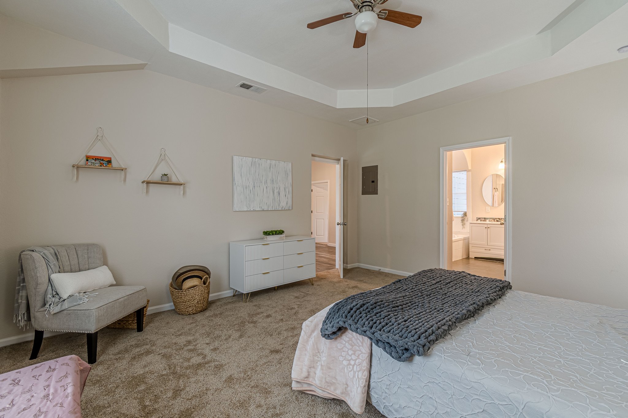 560 Persimmon Pass Fischer, TX 78623 - Photo 14 of 26 a bedroom with a bed and a chandelier