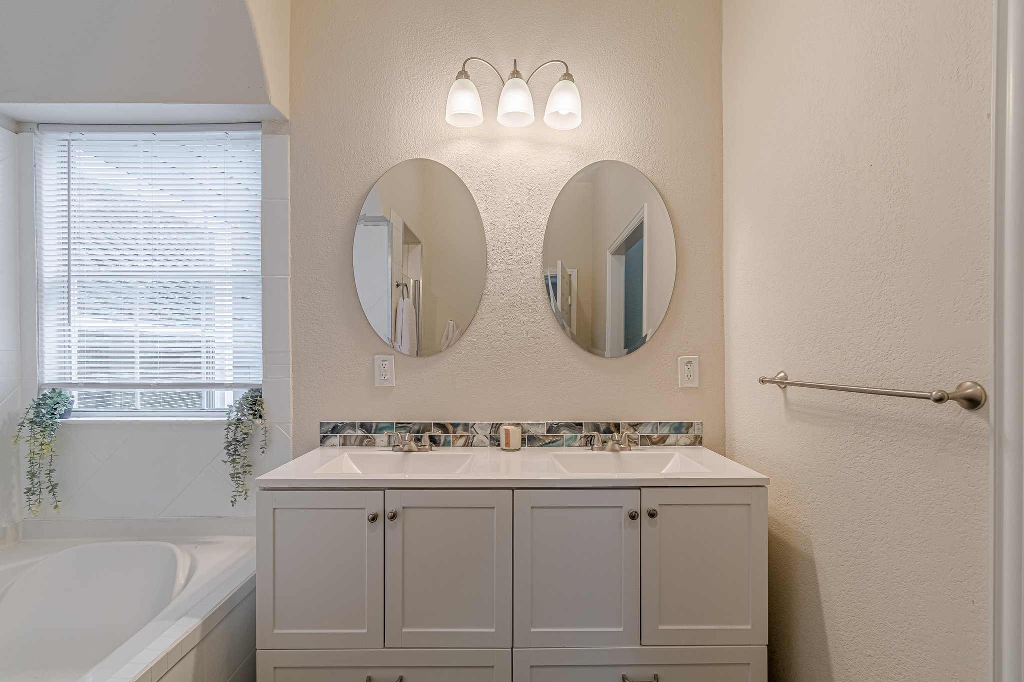 560 Persimmon Pass Fischer, TX 78623 - Photo 15 of 26 a bathroom with a sink and a mirror