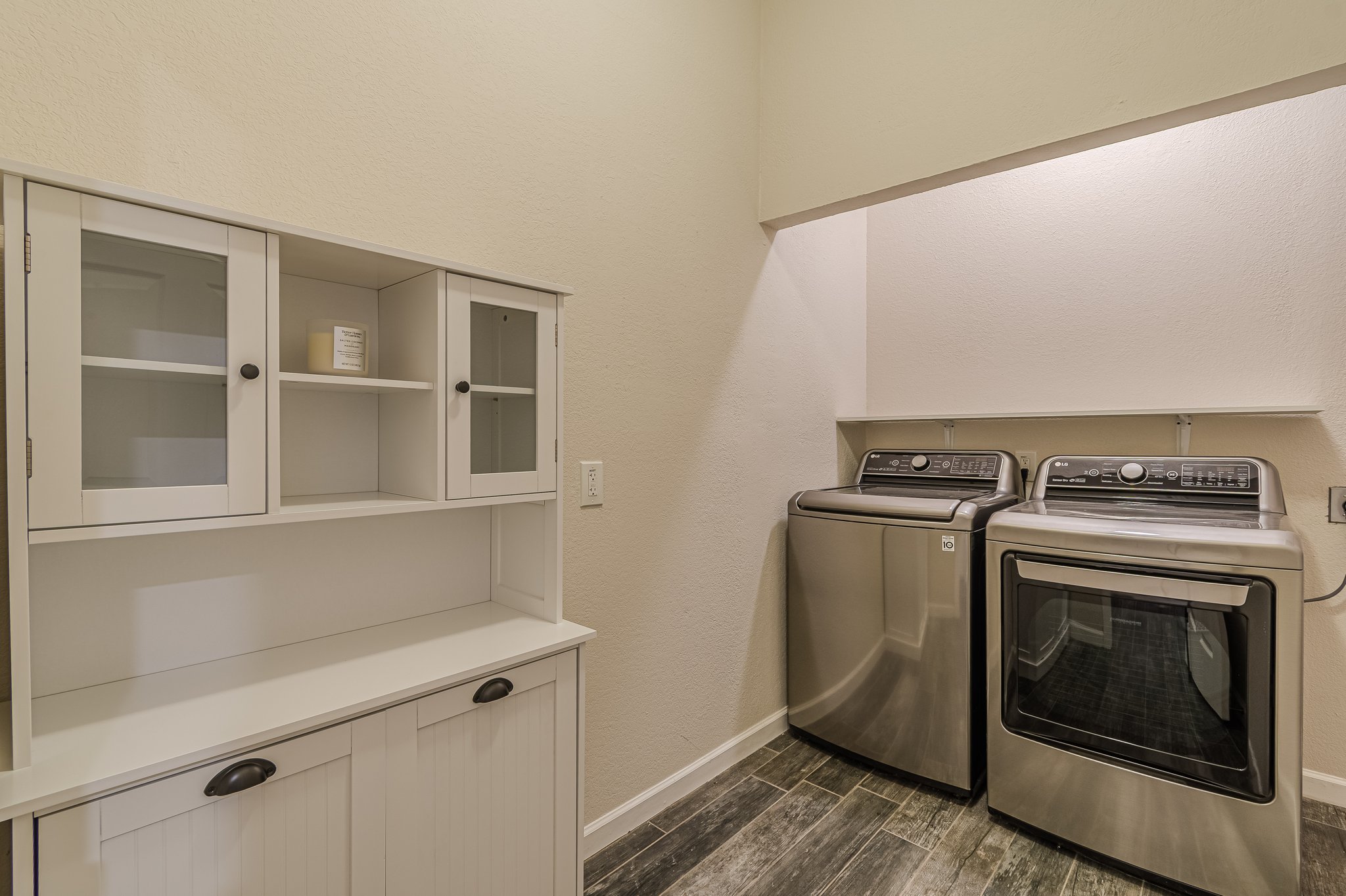 560 Persimmon Pass Fischer, TX 78623 - Photo 19 of 26 a view of storage and utility room with washer and dryer