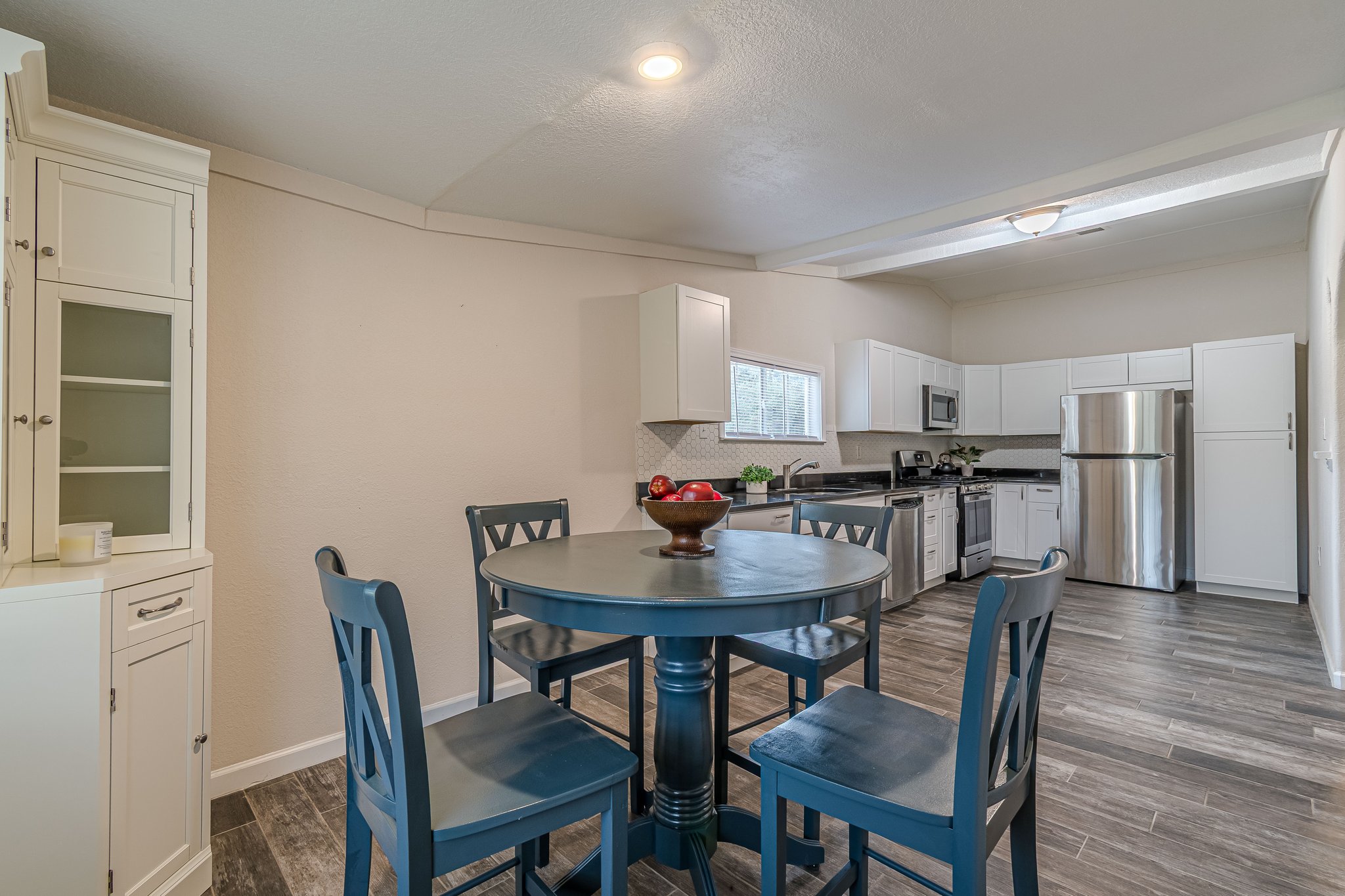 560 Persimmon Pass Fischer, TX 78623 - Photo 8 of 26 a view of a dining room with furniture and wooden floor