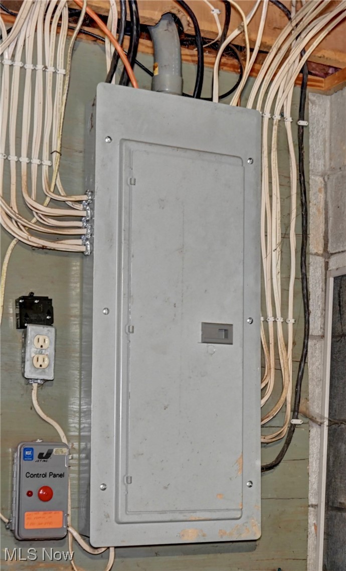 5747 Middle Run Road Dover, OH 44622 - Photo 24 of 30 Utility room featuring electric panel