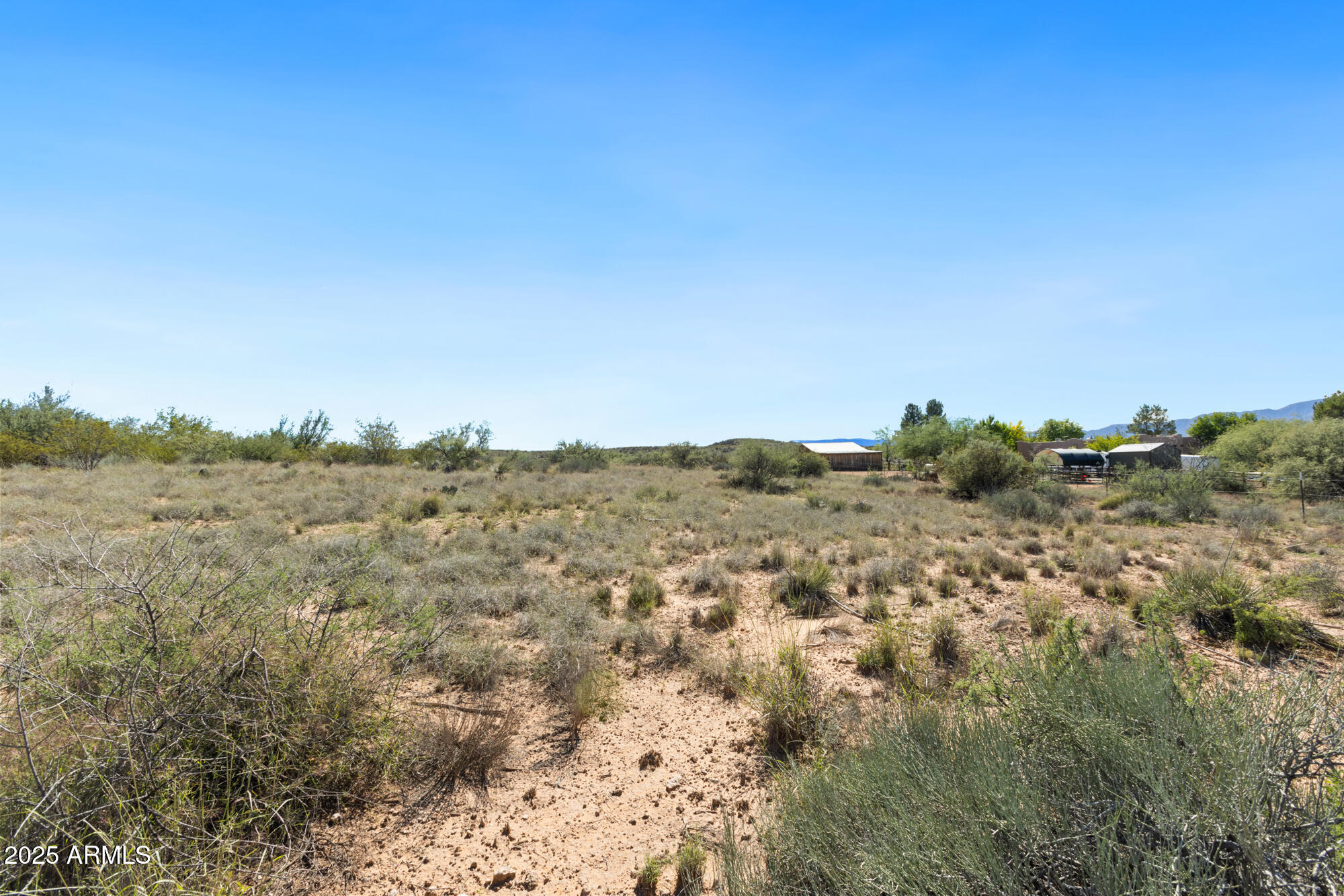 1970 Equestrian Way Cornville, AZ 86325 - Photo 6 of 13 a view of a large building with mountains in the background