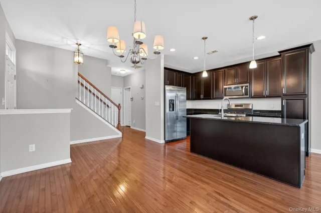 a view of kitchen with microwave and stove