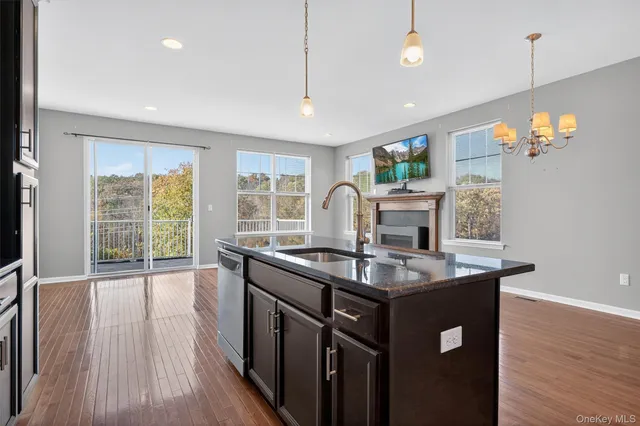 a kitchen with stainless steel appliances granite countertop a stove and a refrigerator