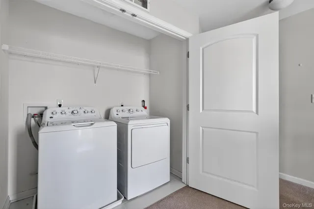 a bathroom with a sink a toilet a mirror and shower