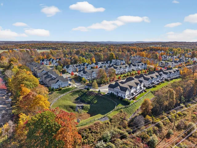 an aerial view of house with yard