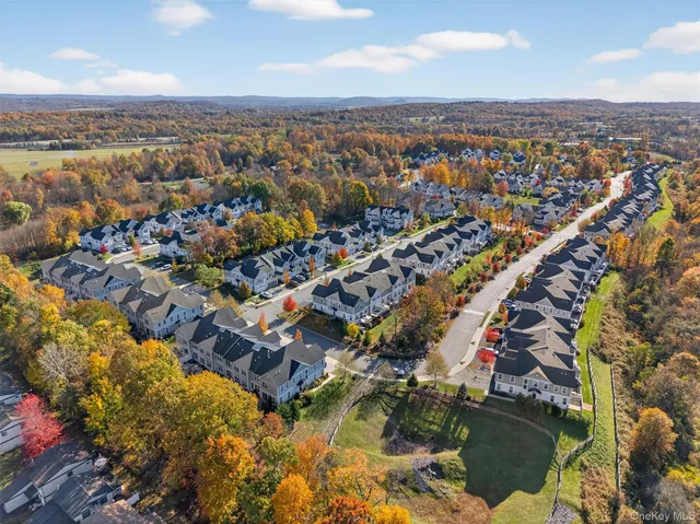 an aerial view of a house with a swimming pool