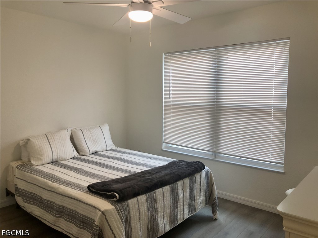 16881 Davis Road, Unit 214 Fort Myers, FL 33908 - Photo 20 of 46 a bedroom with a bed and a window