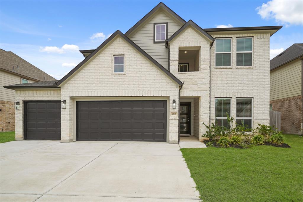 3326 Tilley Drive Rosenberg, TX 77471 - Photo 1 of 30 a front view of a house with a yard and garage