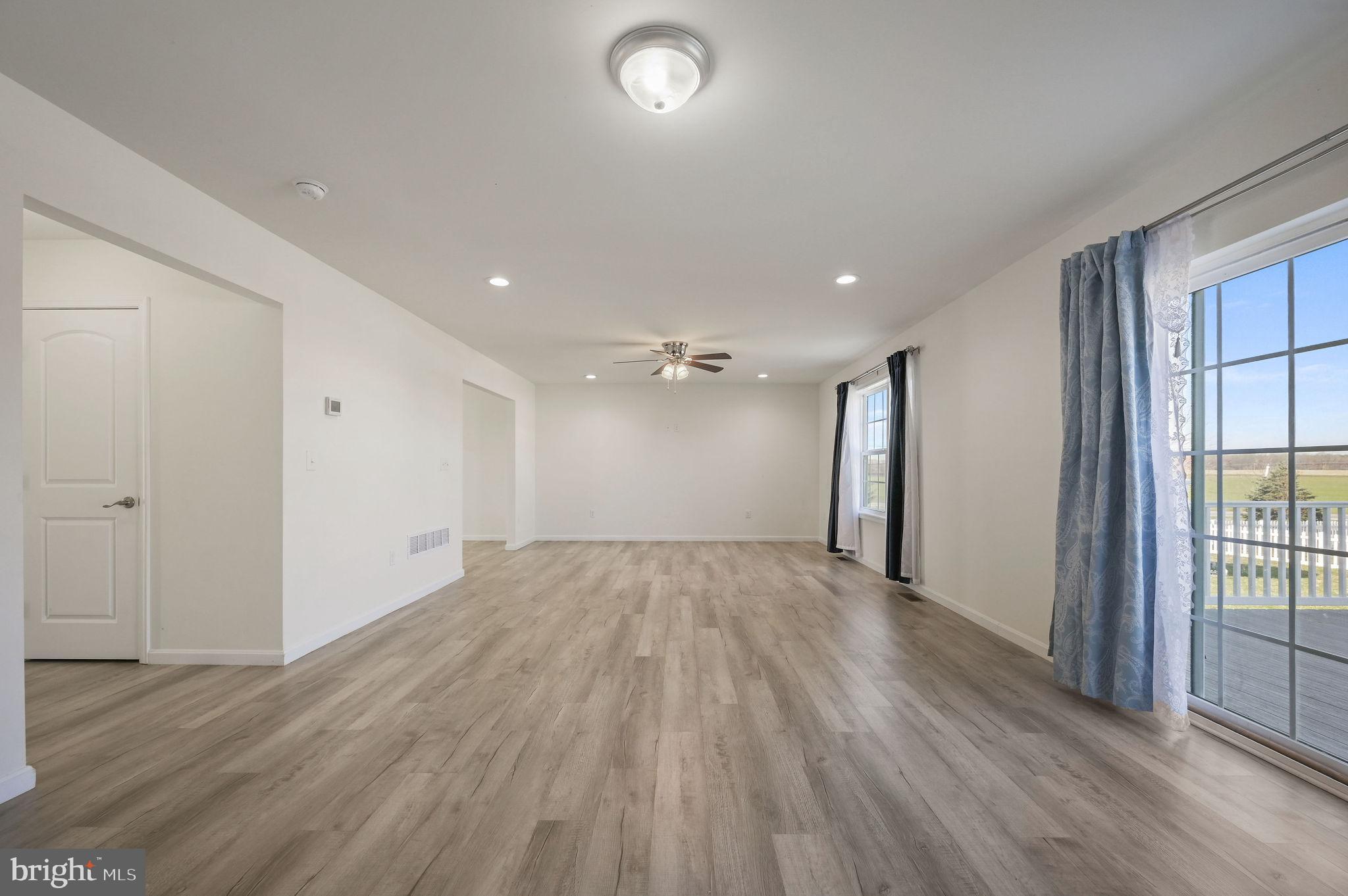 57 Sisal Way Magnolia, DE 19962 - Photo 15 of 30 an empty room with wooden floor and windows