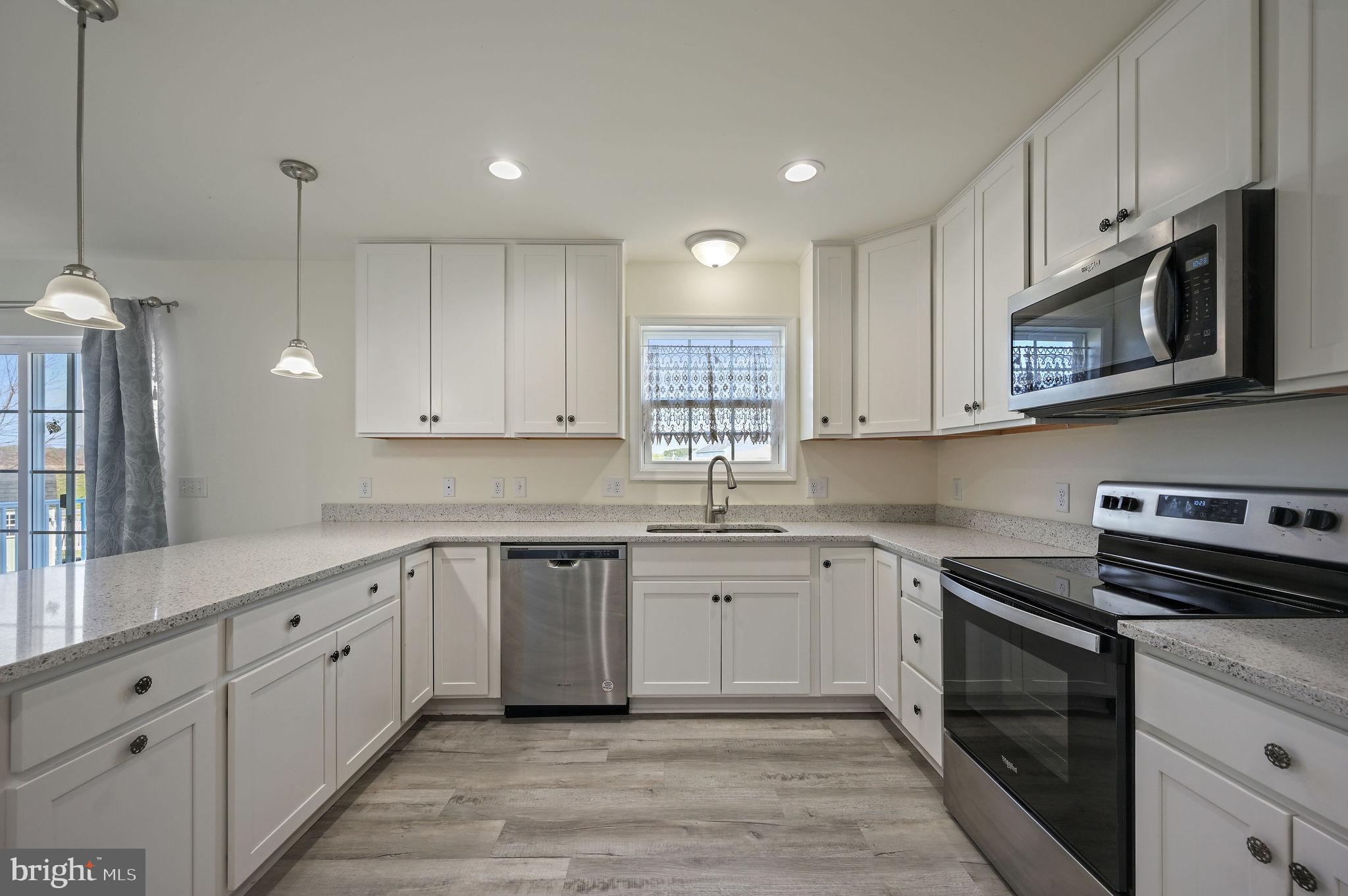 57 Sisal Way Magnolia, DE 19962 - Photo 17 of 30 a kitchen with appliances cabinets and a sink