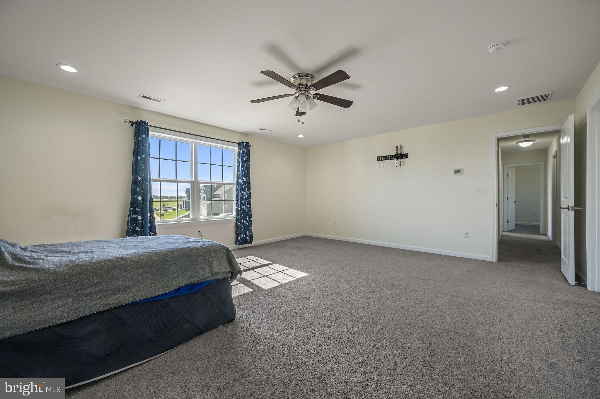 57 Sisal Way Magnolia, DE 19962 - Photo 21 of 30 a bed room with a bed and a window