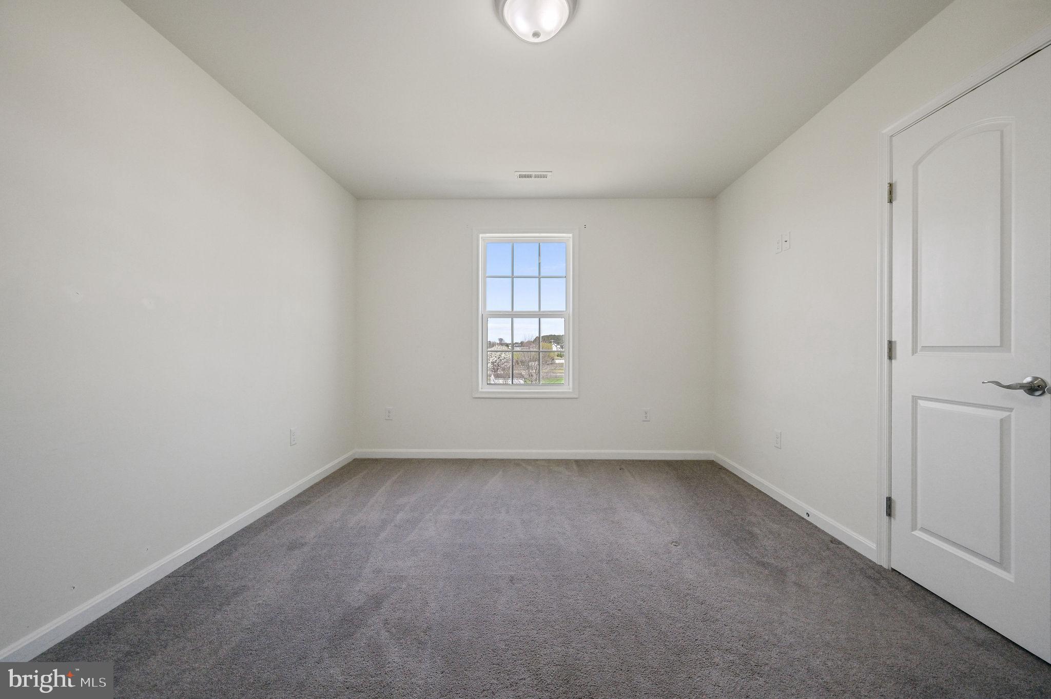 57 Sisal Way Magnolia, DE 19962 - Photo 28 of 30 a view of an empty room with a window