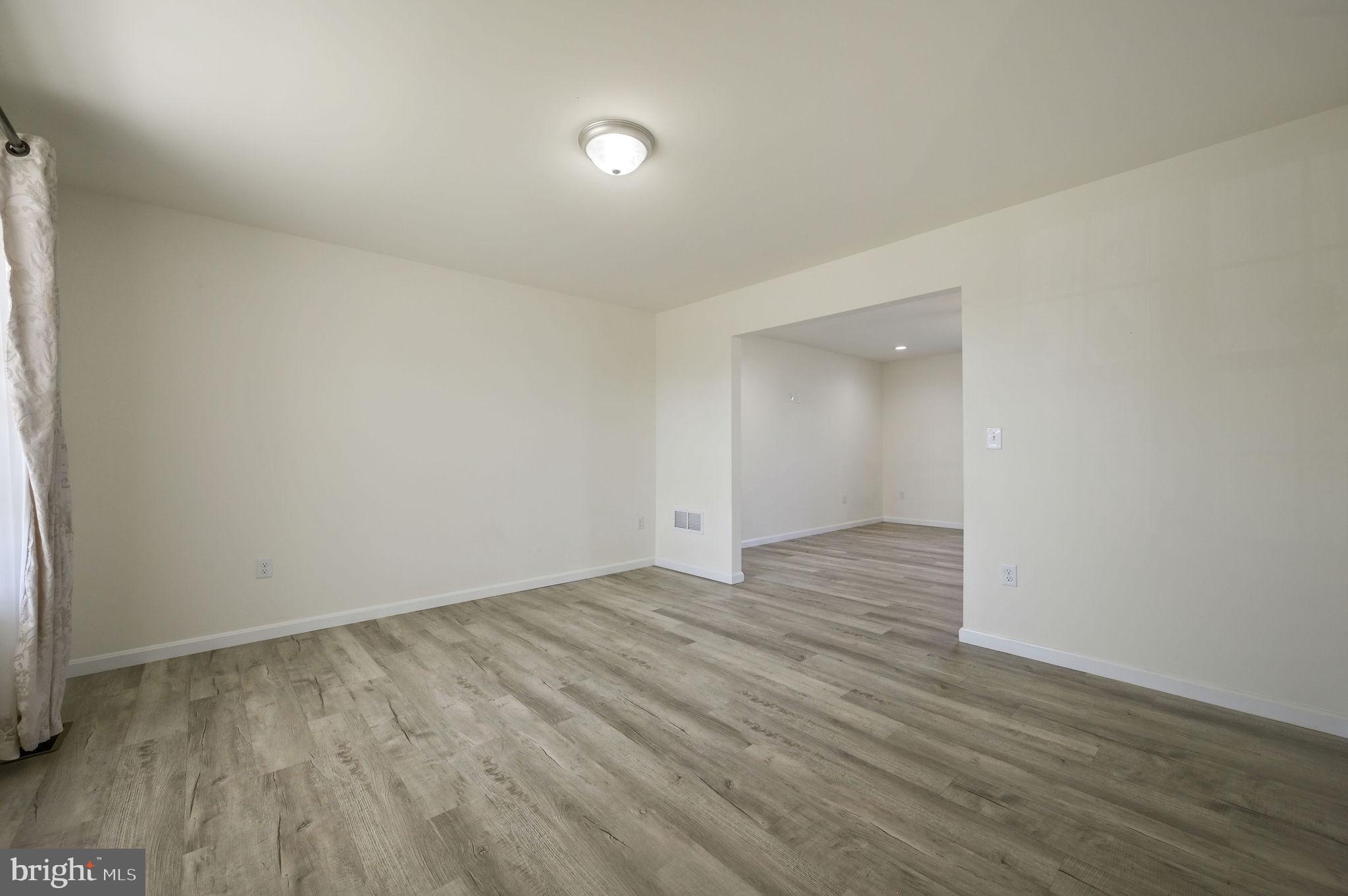 57 Sisal Way Magnolia, DE 19962 - Photo 6 of 30 a view of an empty room and wooden floor