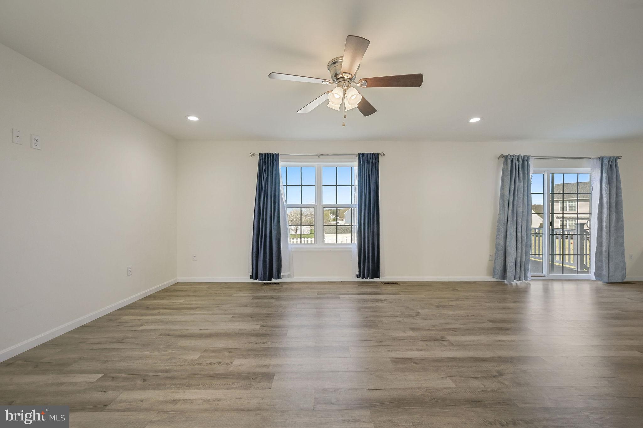 57 Sisal Way Magnolia, DE 19962 - Photo 9 of 30 a view of an empty room with a window and wooden floor