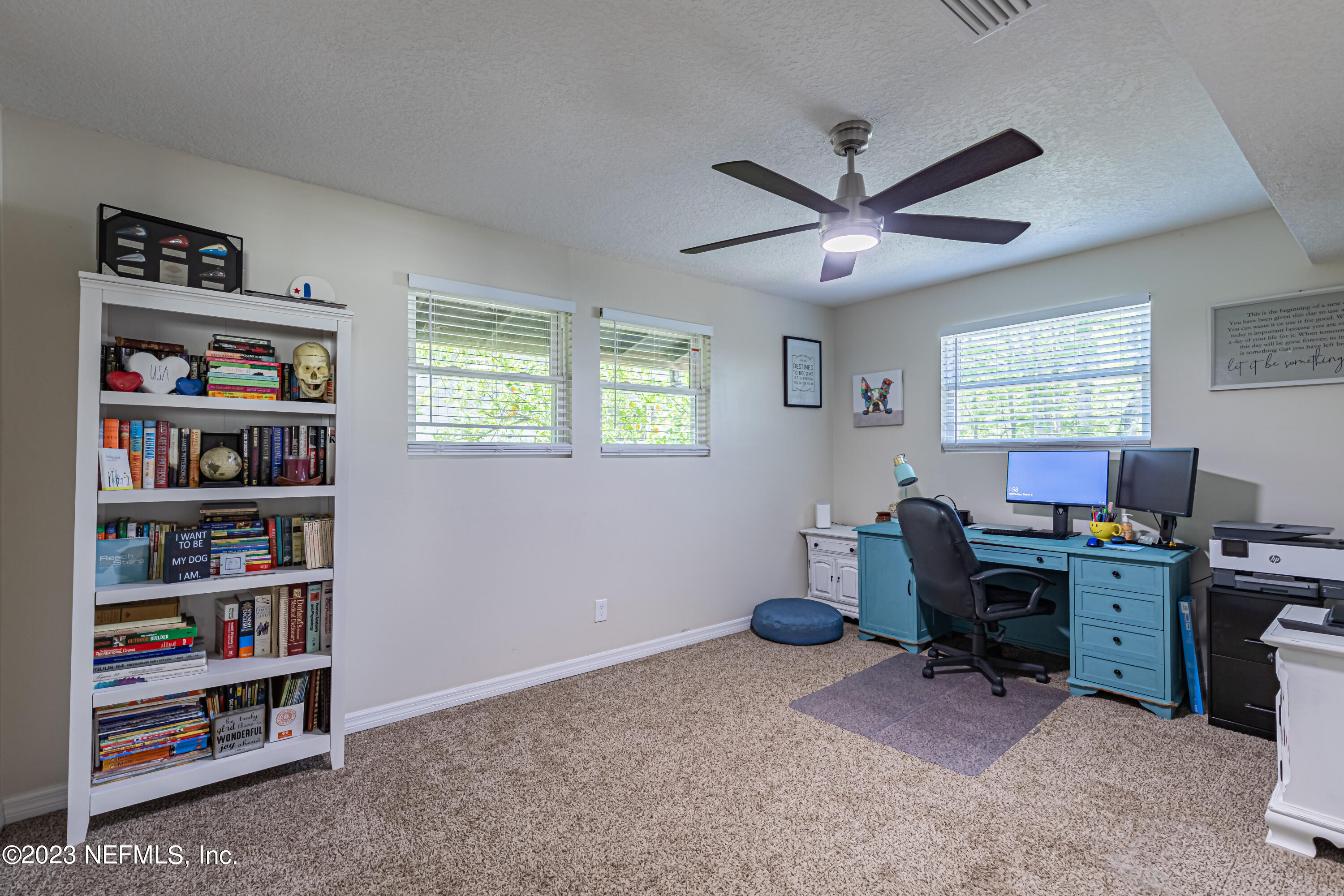 2036 Cornell Road Middleburg, FL 32068 - Photo 11 of 62 a view of a workspace with a bookshelf