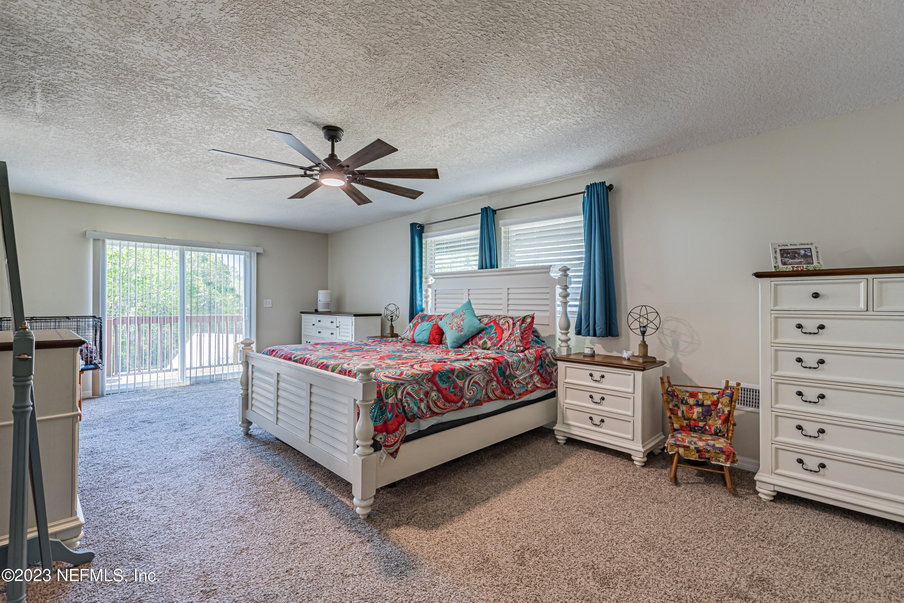2036 Cornell Road Middleburg, FL 32068 - Photo 25 of 62 a bedroom with a bed and a ceiling fan