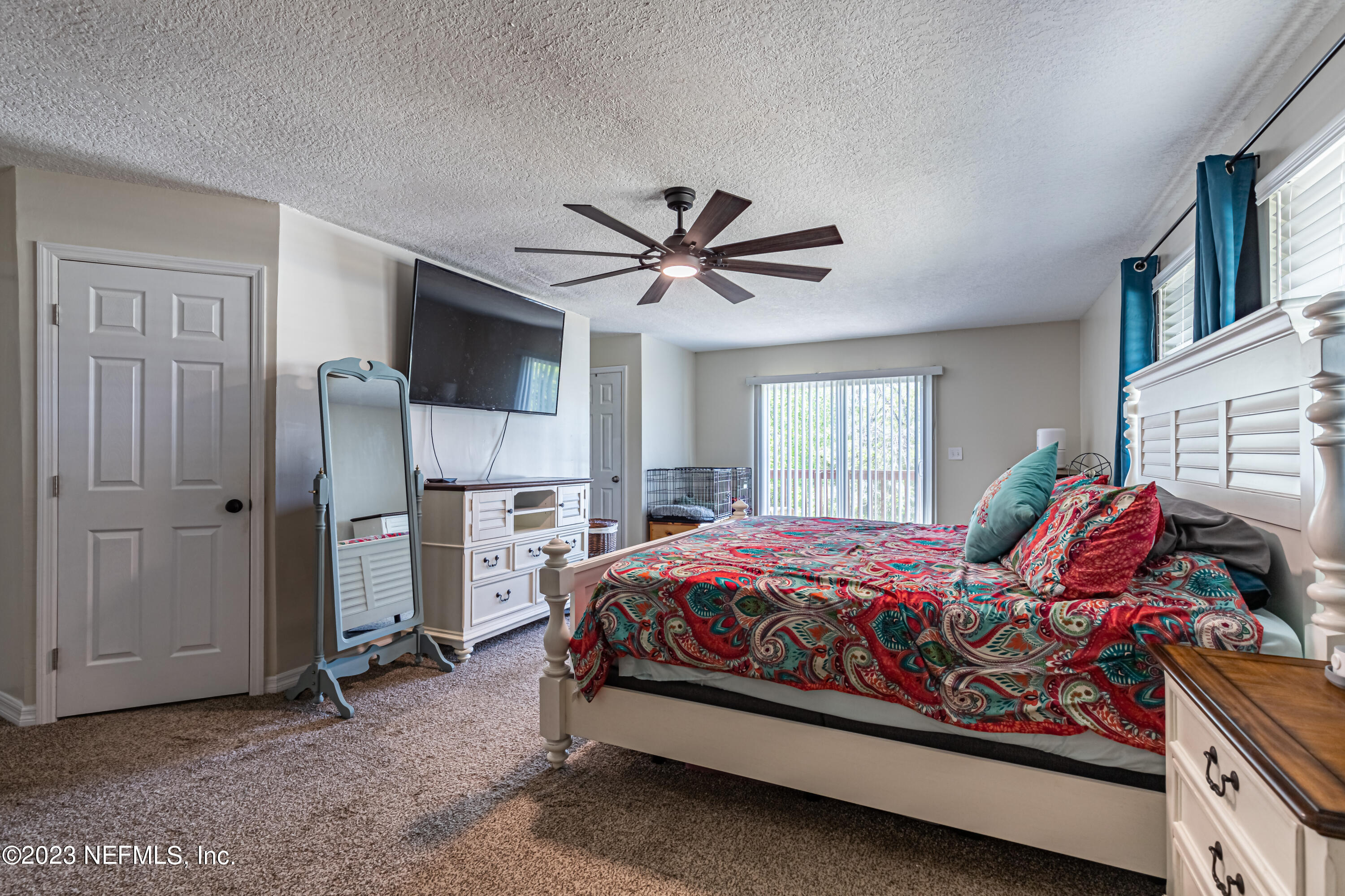 2036 Cornell Road Middleburg, FL 32068 - Photo 26 of 62 a bed room with a bed and a ceiling fan