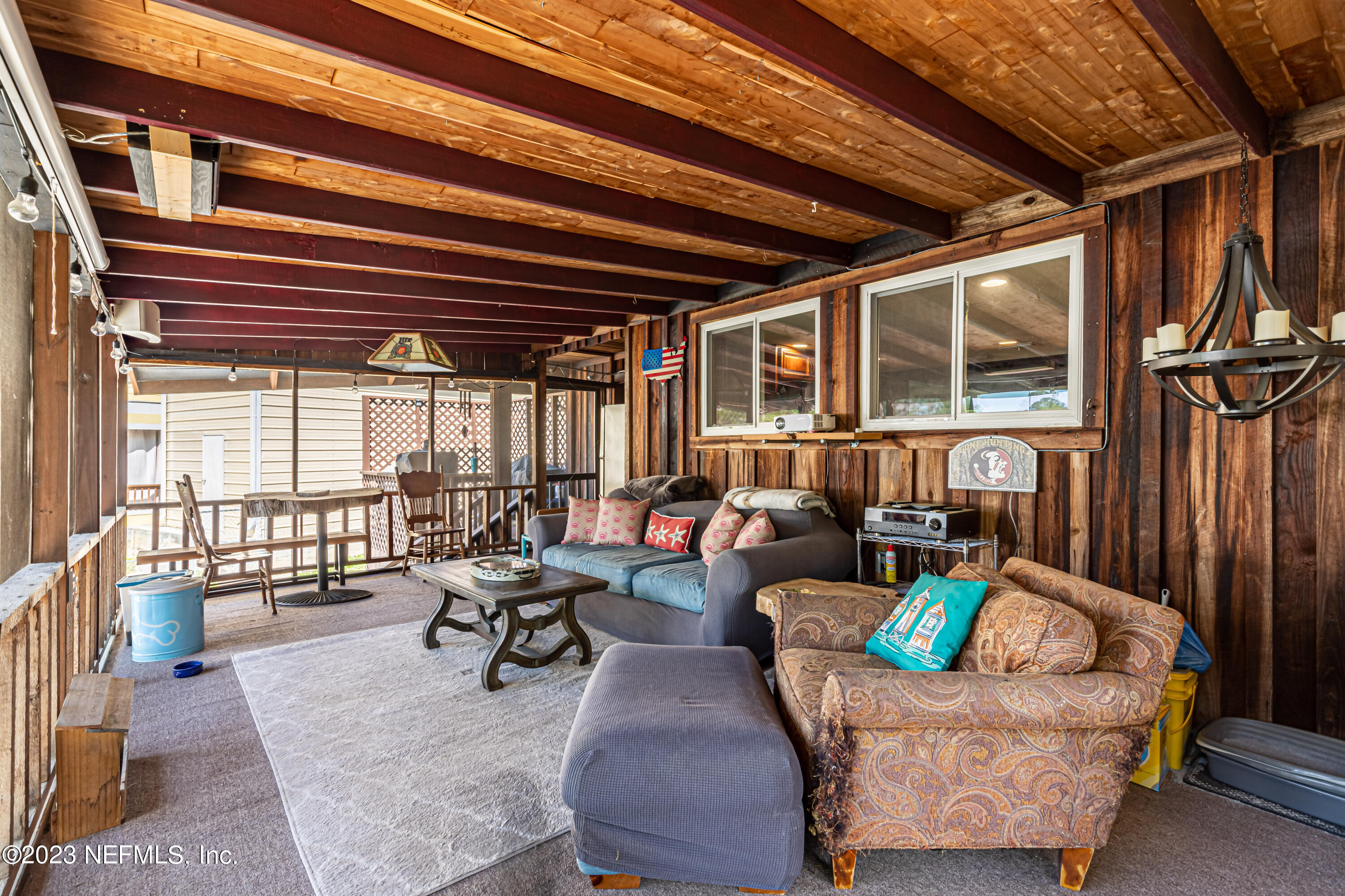 2036 Cornell Road Middleburg, FL 32068 - Photo 39 of 62 a living room with patio furniture and a large window