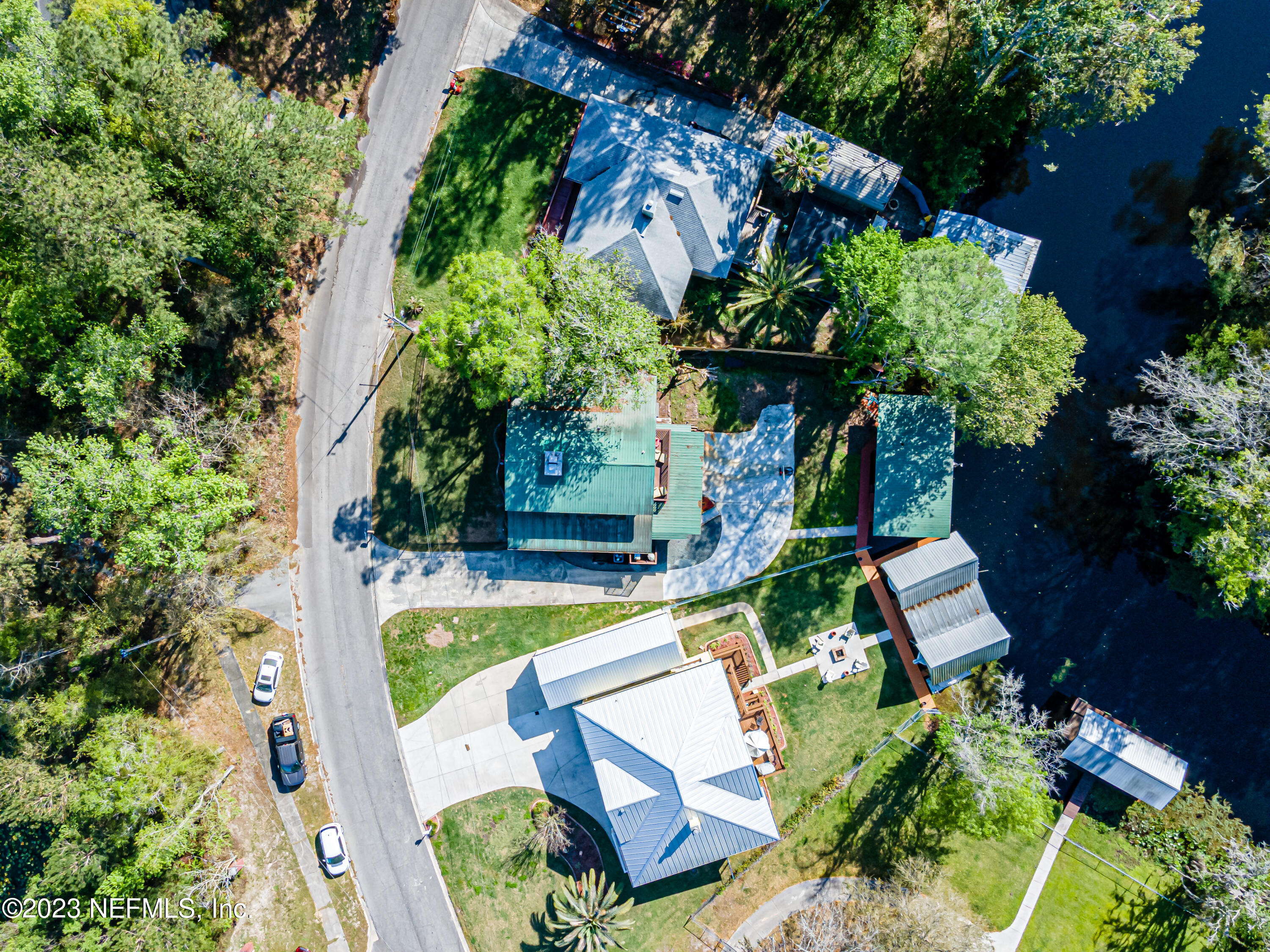 2036 Cornell Road Middleburg, FL 32068 - Photo 59 of 62 an aerial view of a house with swimming pool and garden