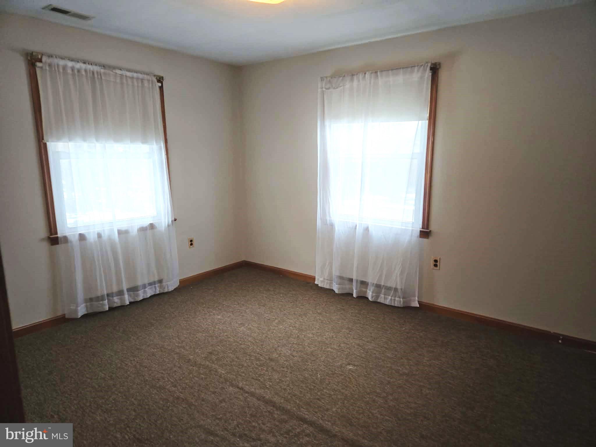 1154 Steamboat Road Shady Side, MD 20764 - Photo 6 of 9 an empty room with a window