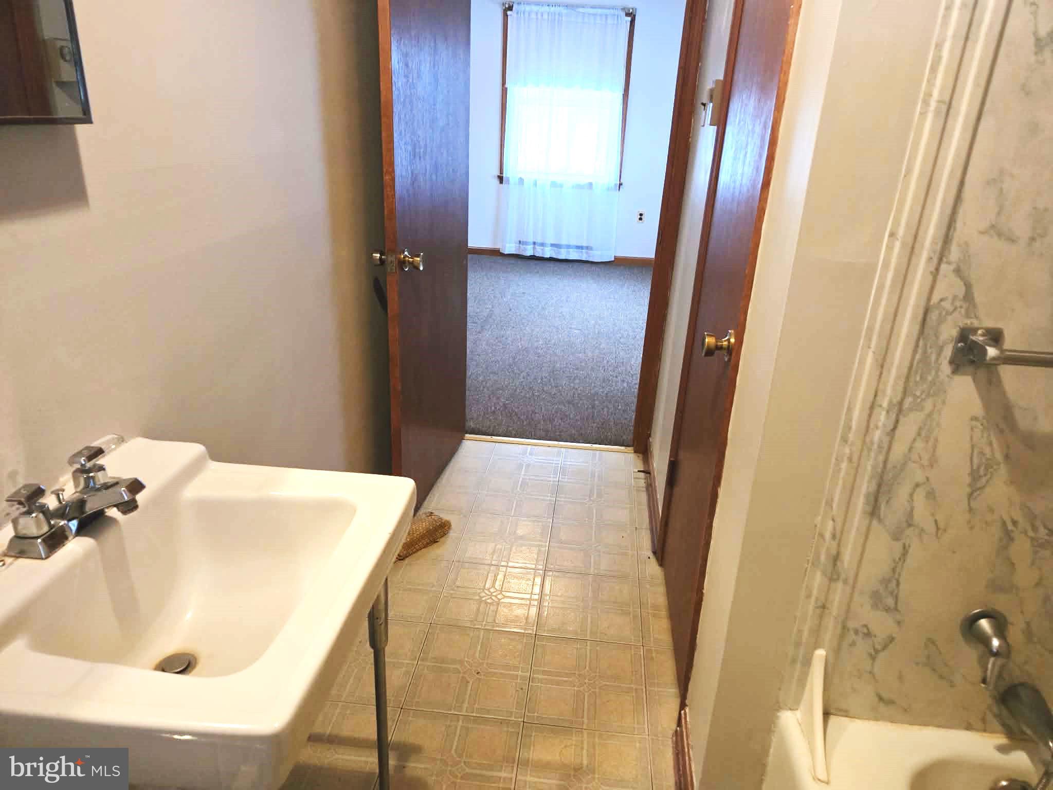 1154 Steamboat Road Shady Side, MD 20764 - Photo 8 of 9 a bathroom with a bathtub and shower