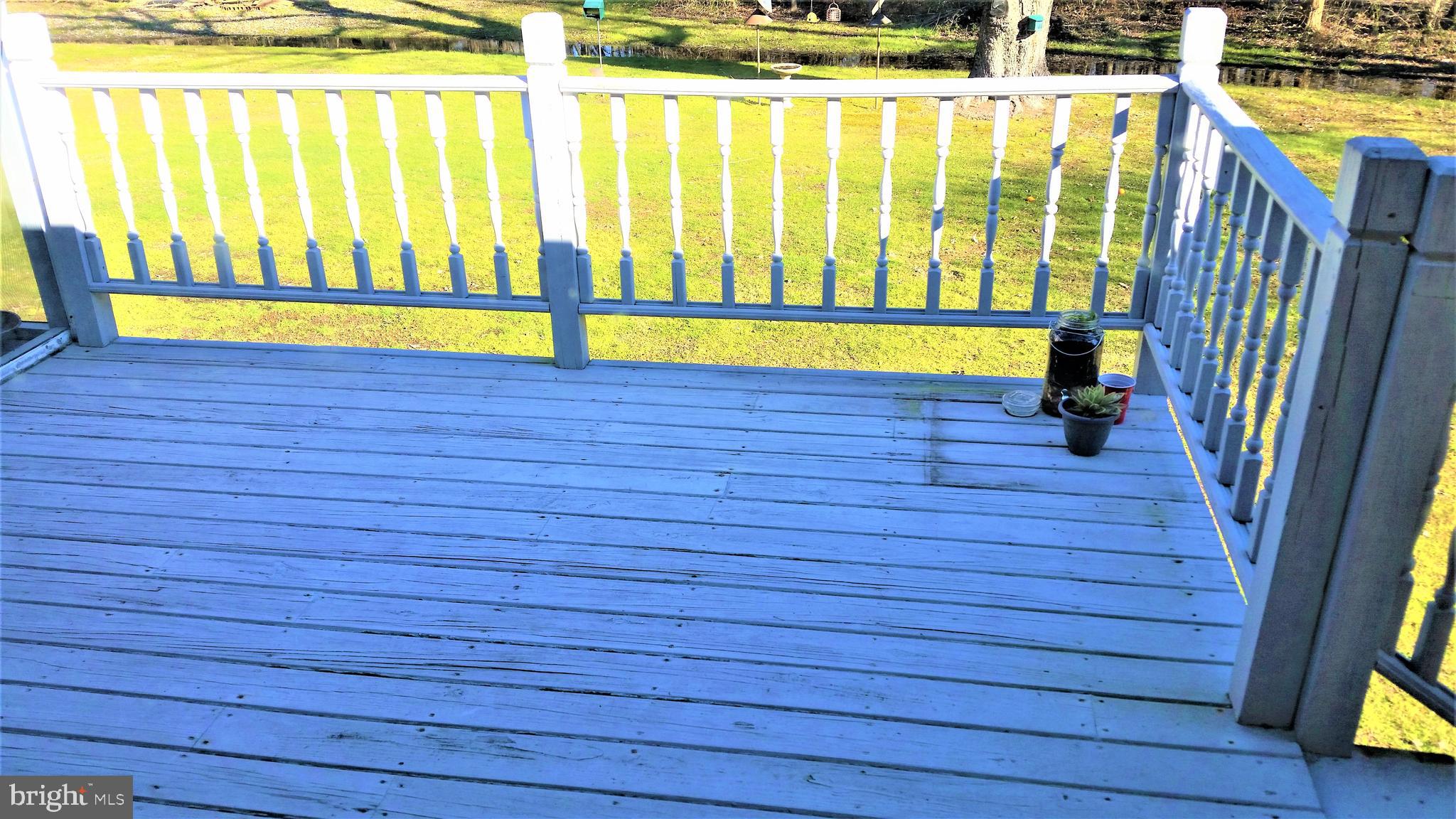 1154 Steamboat Road Shady Side, MD 20764 - Photo 9 of 9 a view of a room with wooden floor and a chair