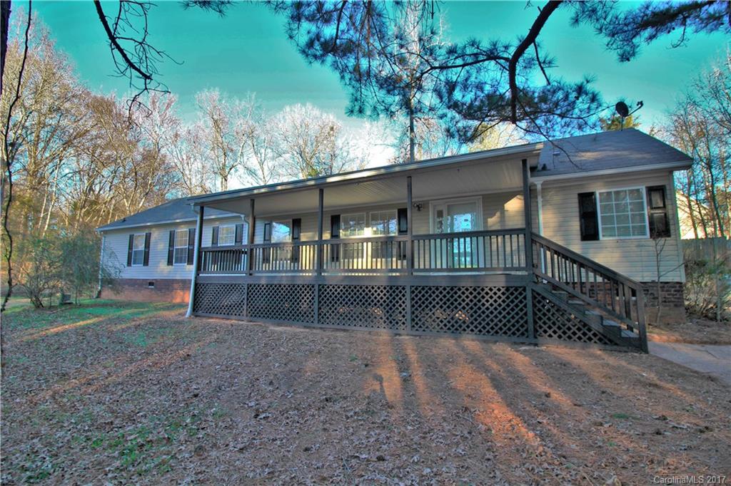 734 Farley Road Fort Mill, SC 29715 - Photo 1 of 23 a front view of a house with a garden