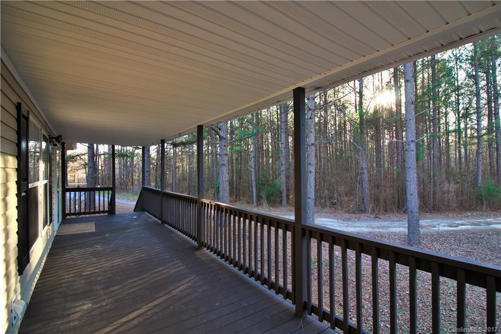 734 Farley Road Fort Mill, SC 29715 - Photo 3 of 23 a view of a porch with wooden floor and outdoor space
