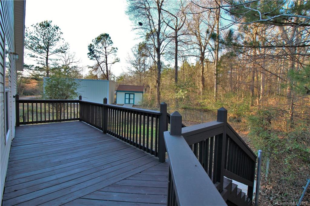 734 Farley Road Fort Mill, SC 29715 - Photo 22 of 23 a balcony with wooden floor and trees