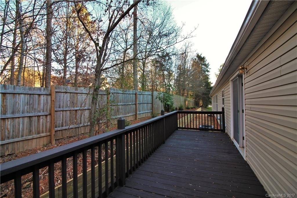 734 Farley Road Fort Mill, SC 29715 - Photo 23 of 23 a view of a balcony with wooden floor and fence and trees