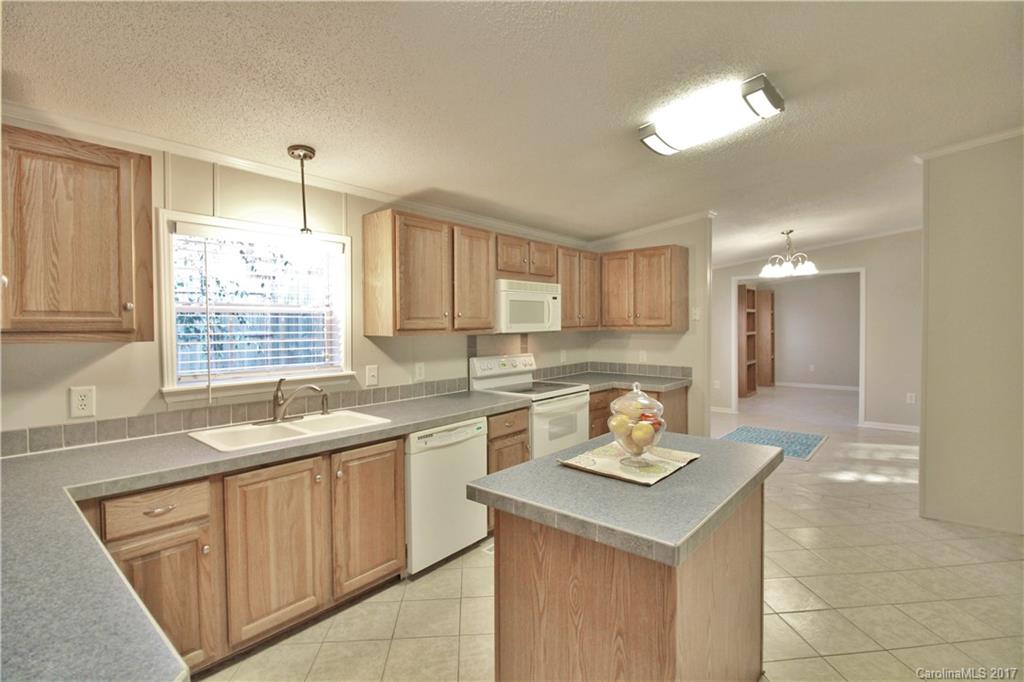 734 Farley Road Fort Mill, SC 29715 - Photo 9 of 23 a kitchen with a sink stove and cabinets