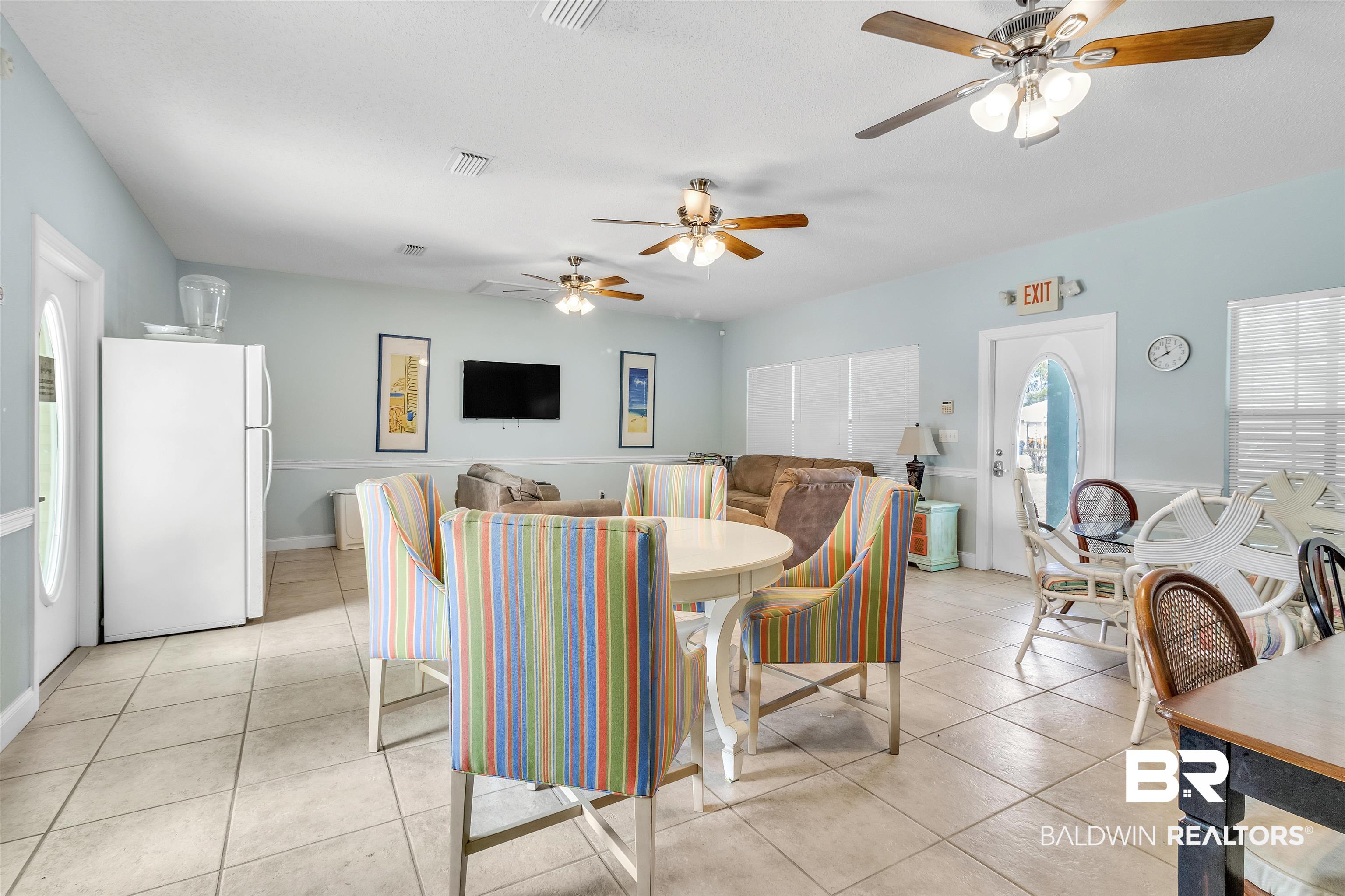 4324 B Lindsey Lane, Unit 4324B Orange Beach, AL 36561 - Photo 5 of 33 Dining room featuring visible vents, ceiling fan, and light tile patterned floors